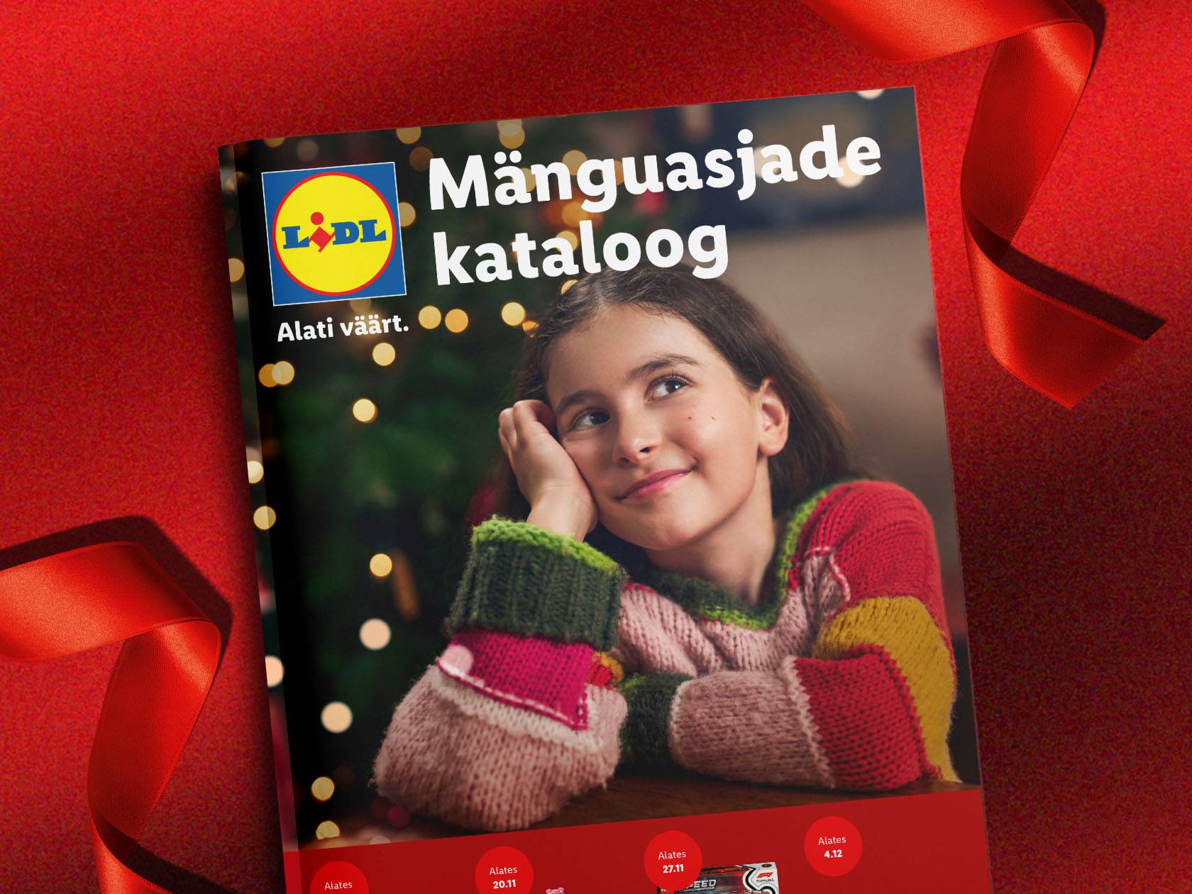 Lidli mänguasjade kataloog, mille kaanel on unistav tüdruk ja jõulutuled.