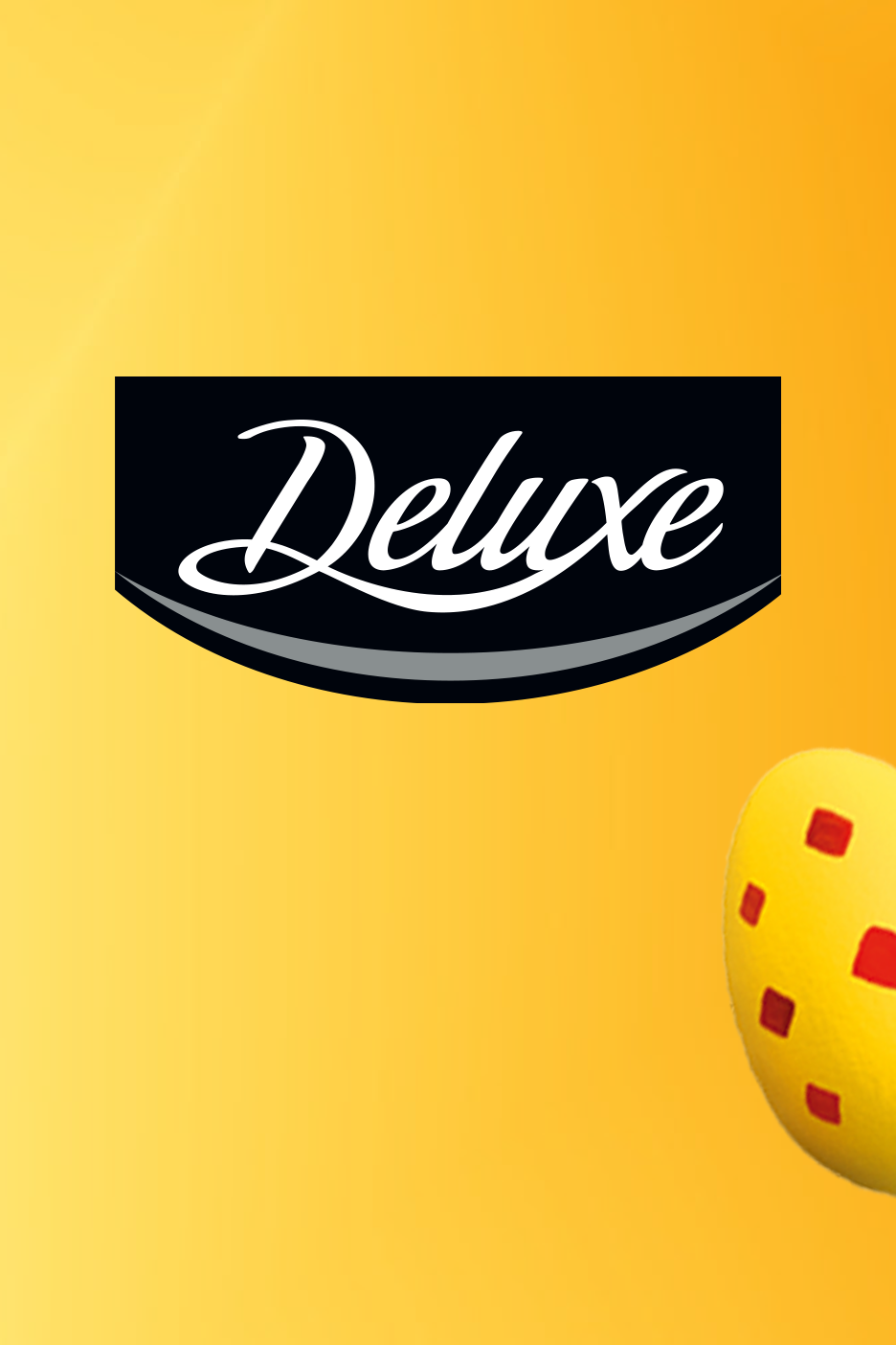 Logo tekstiga 'Deluxe' mustal taustal ja kollane muna punaste ruutudega.